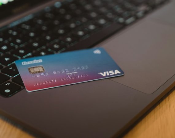blue and white visa card on silver laptop computer