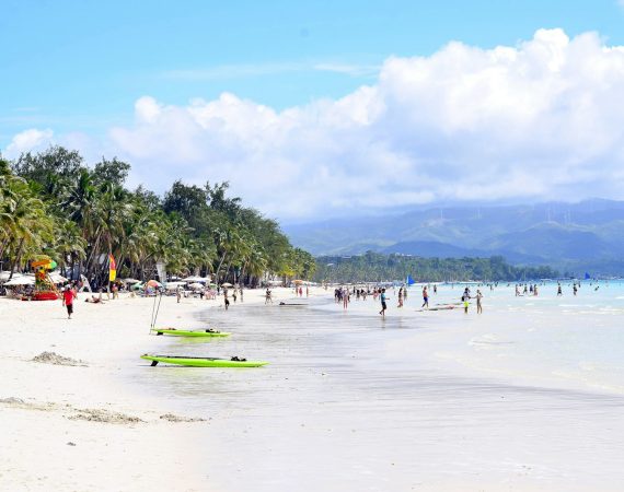 people standing on shoreline