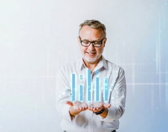 Man smiling with data chart hologram representing financial growth in hands