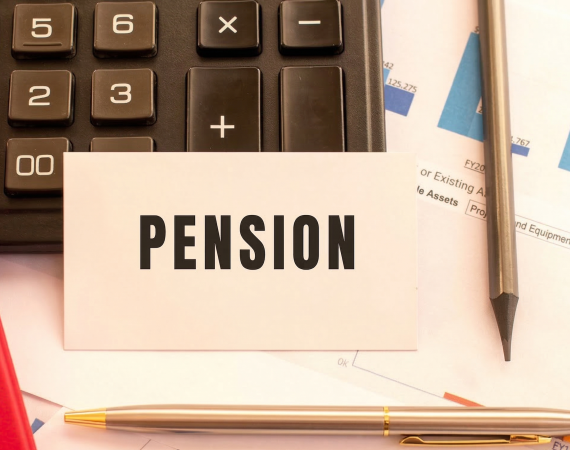 Calculator and financial documents with a pension card and pen on a desk for retirement planning